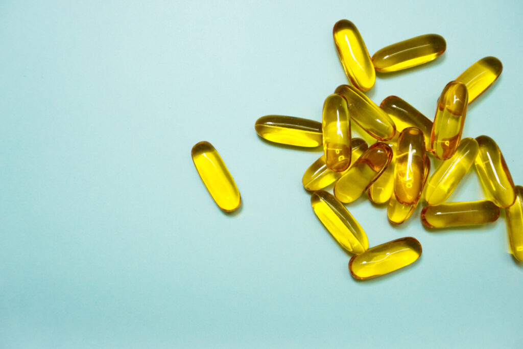 Several gel cap vitamins sprinkled about.