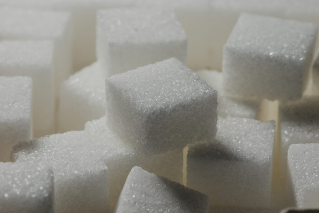 Several sugar cube squares stacked on top of each other.
