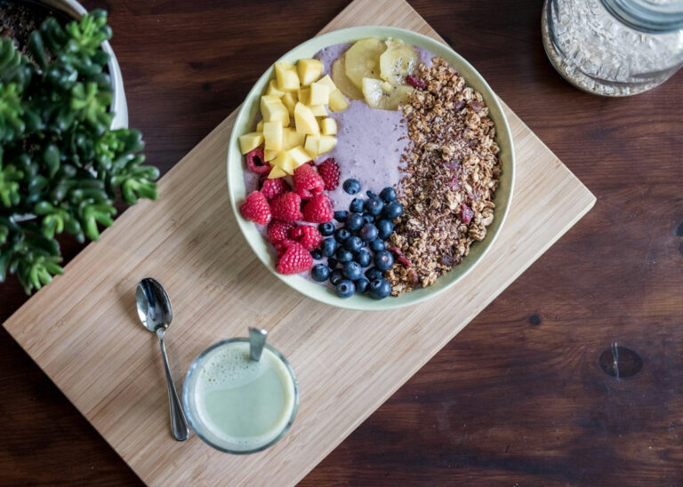 Yogurt parfait bowl with yogurt, blueberries, raspberries, pineapple, and granola