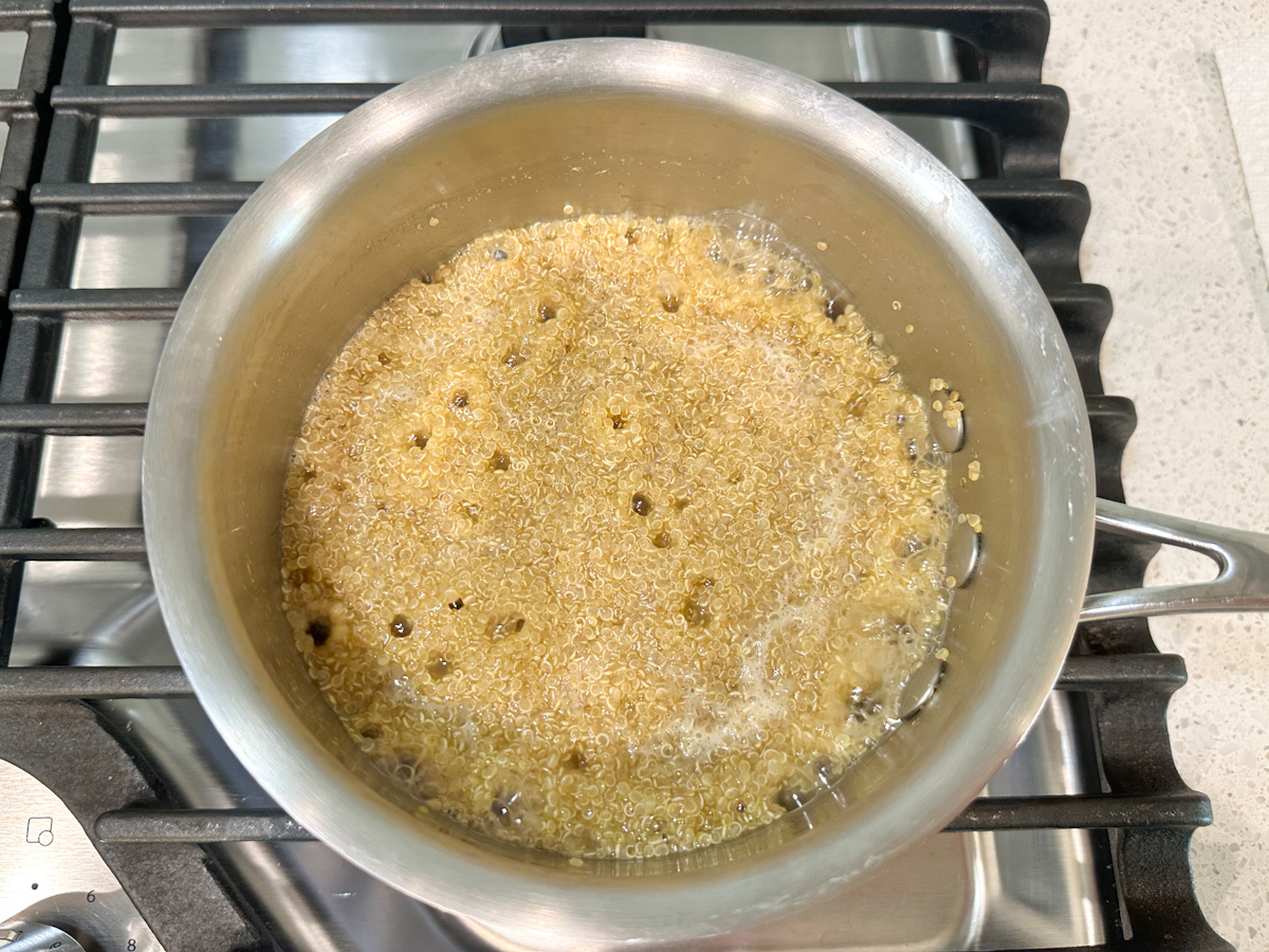 Quinoa cooking in a pot.