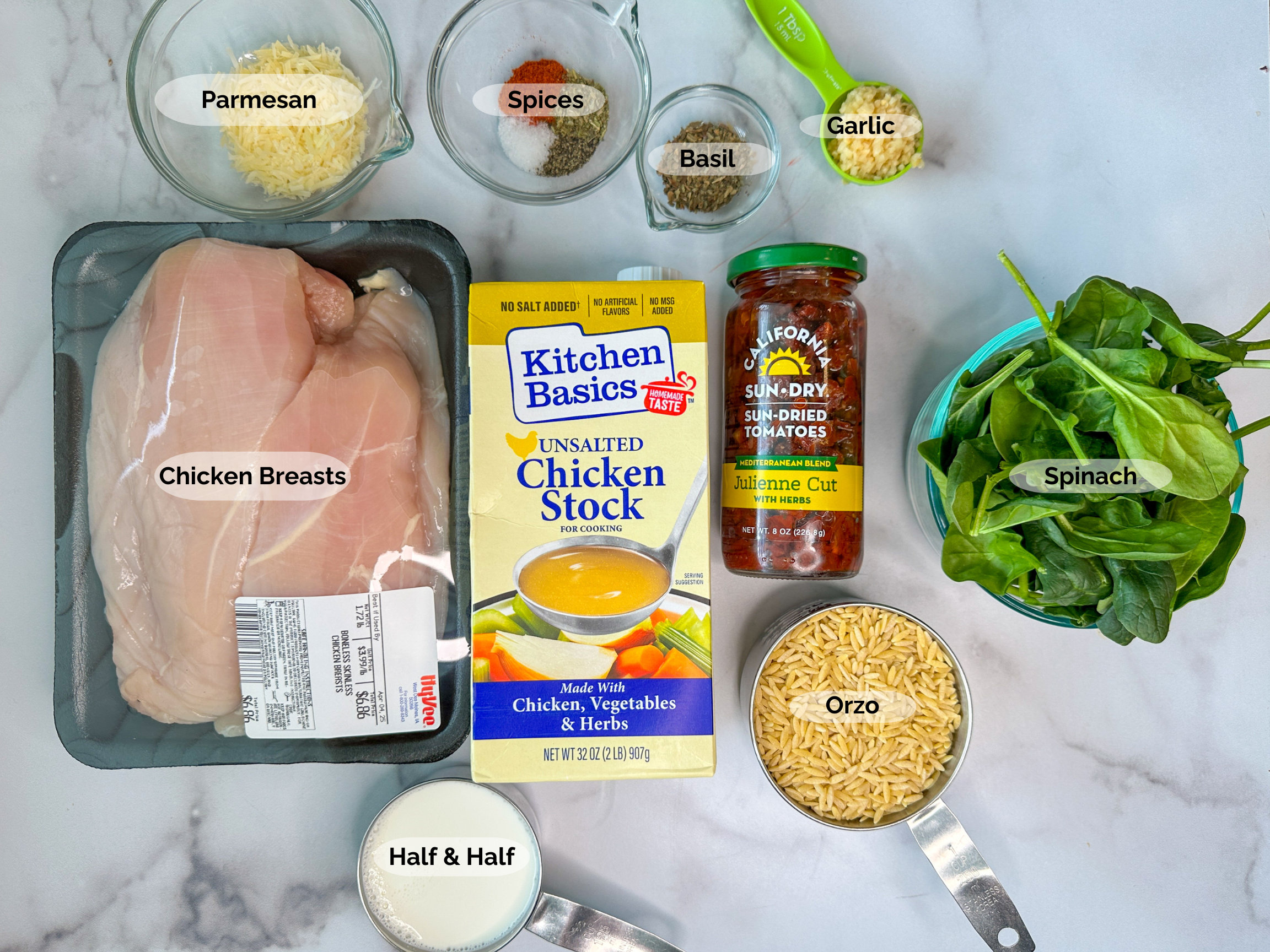 Creamy Tuscan Chicken Orzo ingredients: chicken breasts, parmesan, spices, basil, garlic, chicken stock, sun-dried tomatoes, spinach, orzo, and half and half