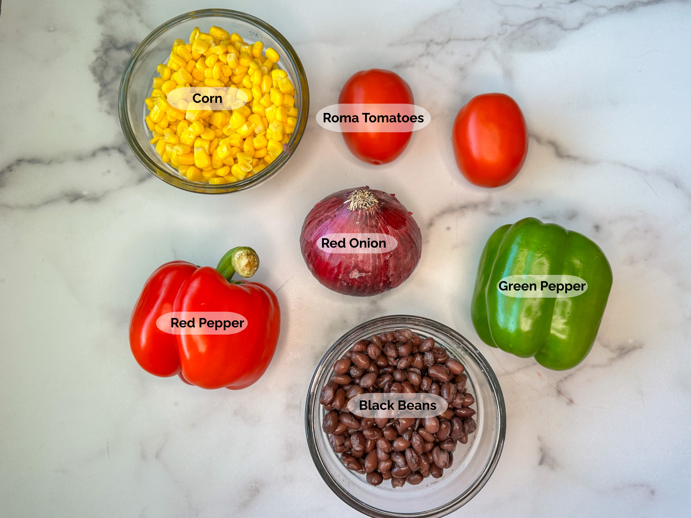Healthy Cowboy Caviar ingredients: corn, roma tomatoes, red onion, green bell pepper, black beans, red bell pepper.