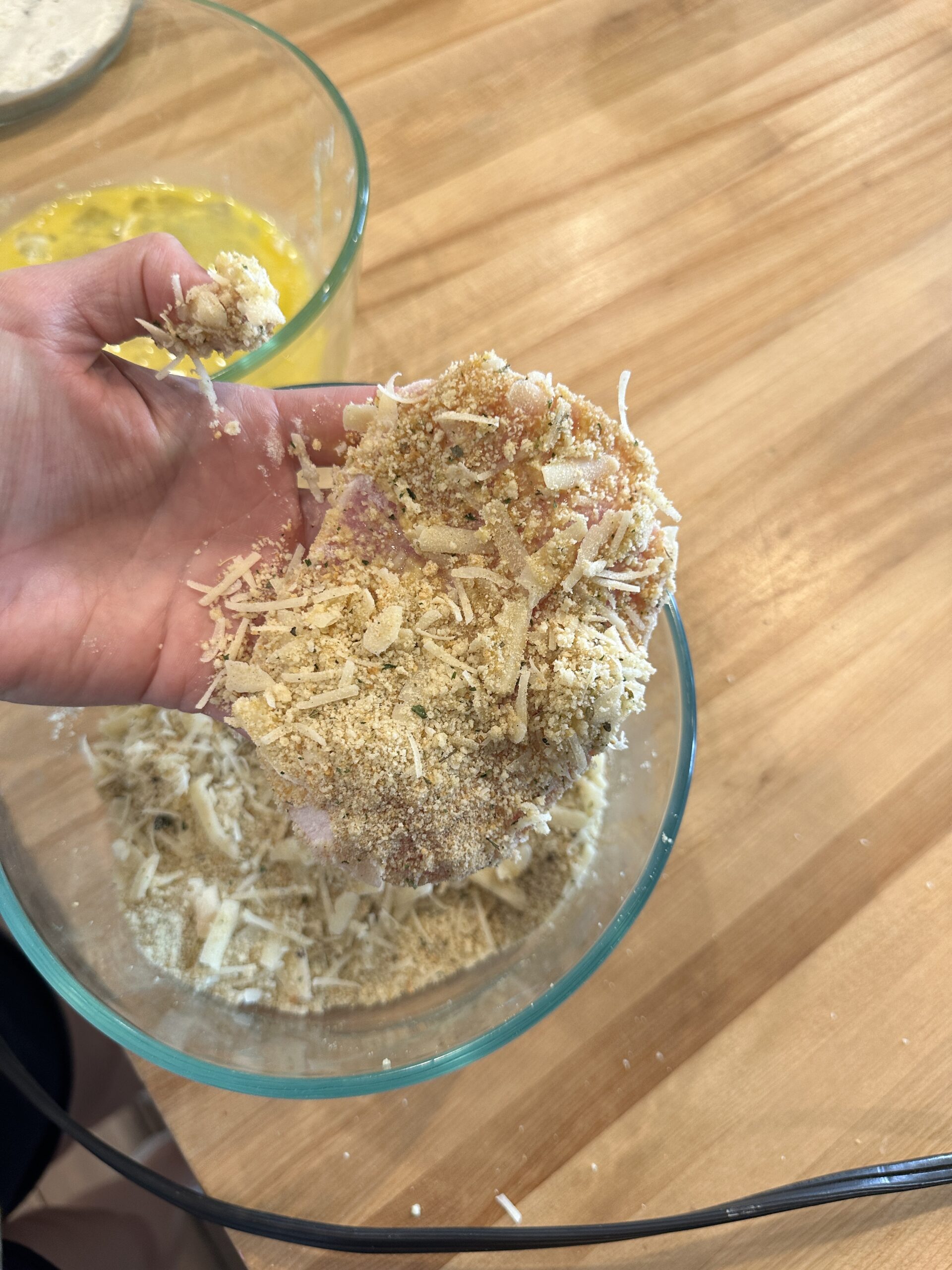 pork chop breaded and coated in breading and parmesan cheese.