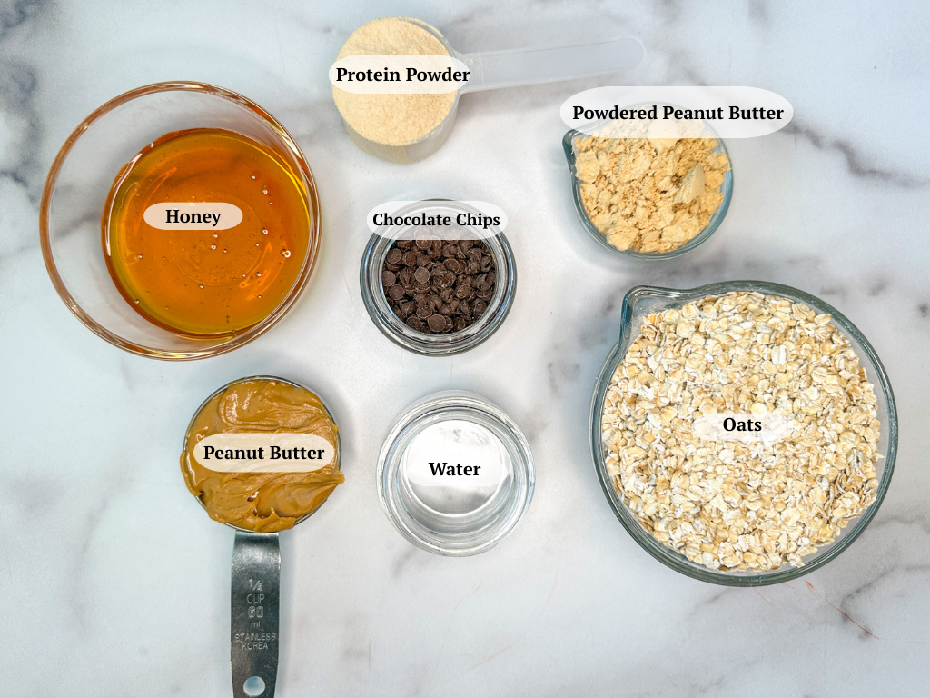 Protein balls ingredients: honey, protein powder, powdered peanut butter, chocolate chips, oats, peanut butter, water