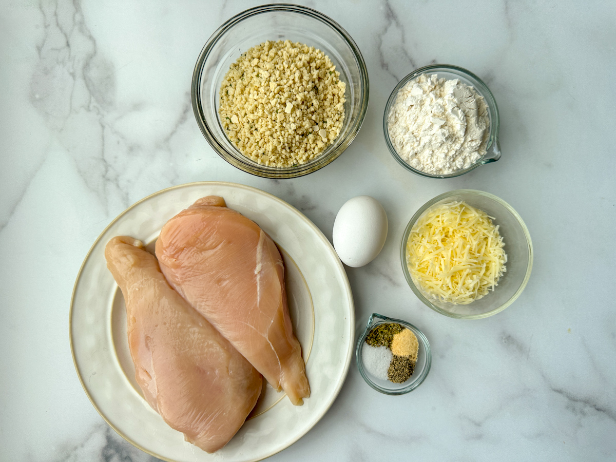 2 large chicken breasts, panko breadcrumbs, flour, egg, seasonings, and shredded parmesan cheese