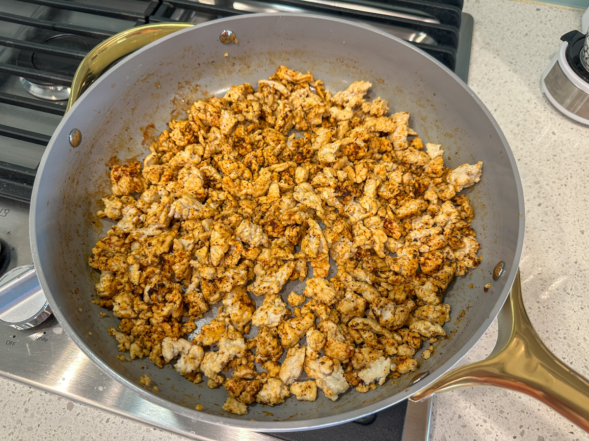 Ground turkey in a large skillet with spices