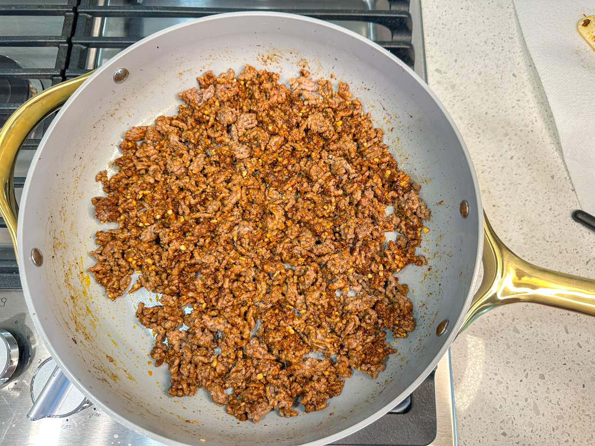 Seasoned ground beef in a large skillet