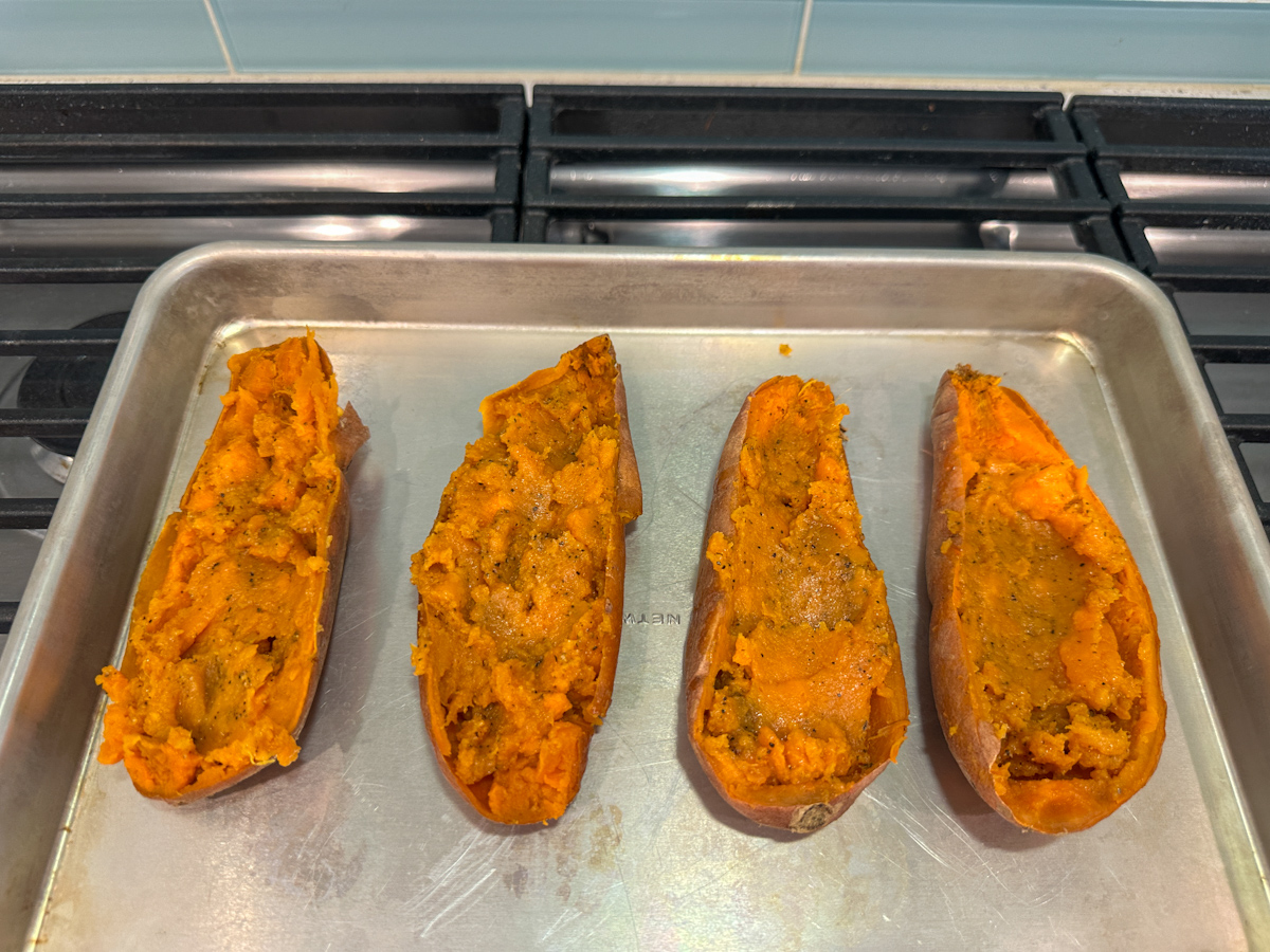 Cooked sweet potatoes with mashed up filling