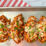 4 stuffed sweet potatoes filled with ground turkey, crushed tomatoes and topped with pepper jack cheese and diced green onions