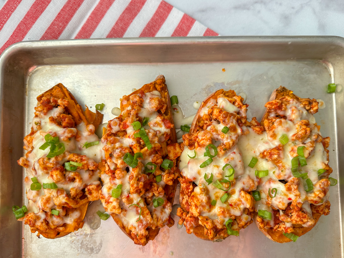 4 stuffed sweet potatoes filled with ground turkey, crushed tomatoes and topped with pepper jack cheese and diced green onions