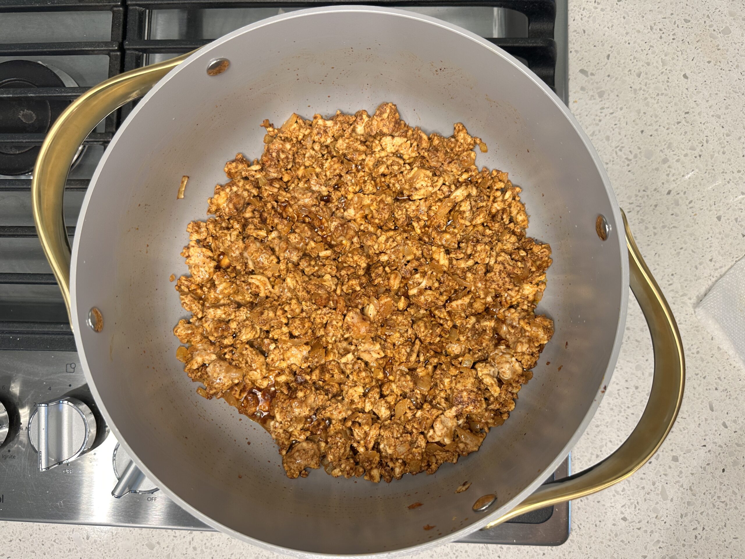 Browned turkey, onions, and garlic with spices mixed in.