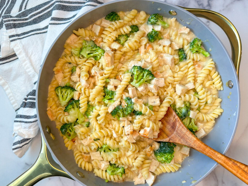 Lighter Chicken Alfredo with Broccoli in a large skillet with rotini pasta, steamed broccoli, chopped chicken, alfredo sauce