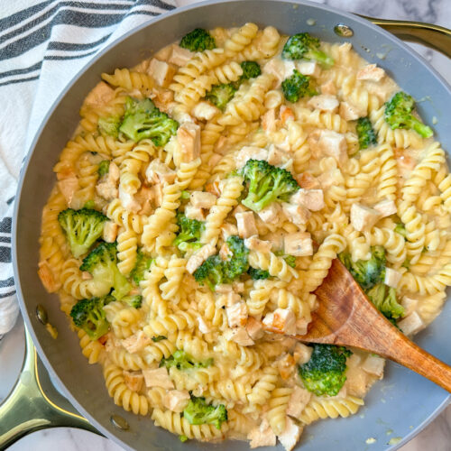 Lighter Chicken Alfredo with Broccoli in a large skillet with rotini pasta, steamed broccoli, chopped chicken, alfredo sauce