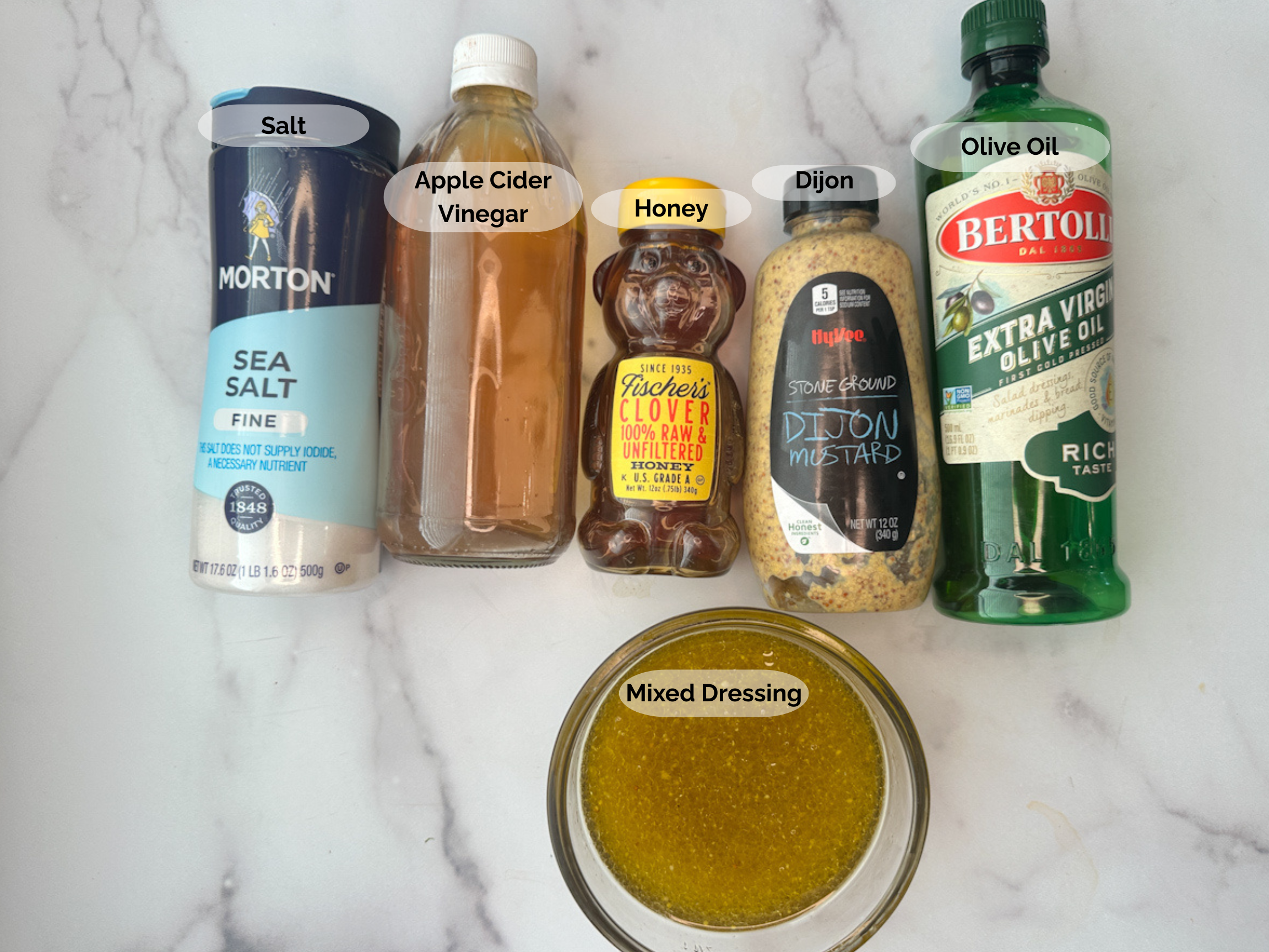 Fall Brussels Sprouts and Apple Salad Dressing Ingredients: salt, apple cider vinegar, honey, Dijon mustard, olive oil and a bowl of mixed dressing