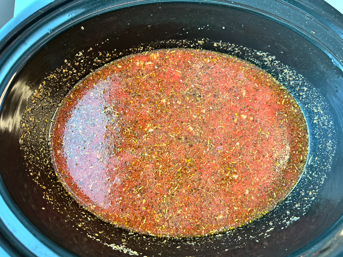 Tuscan Tortellini Soup in a crockpot.