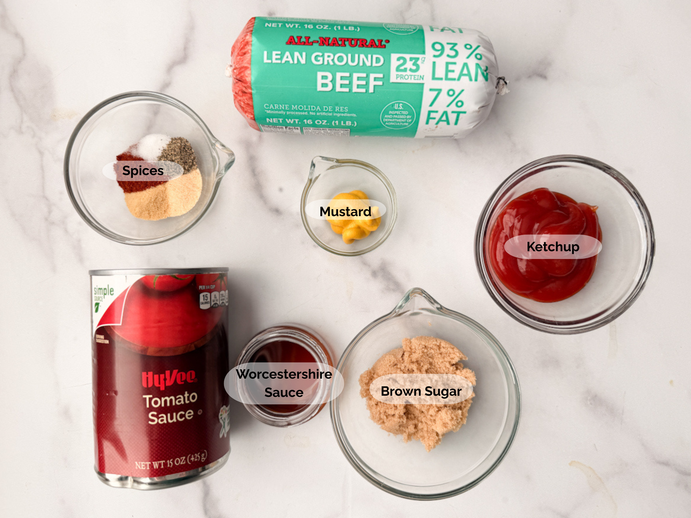 Slow Cooker Sloppy Joe ingredients: lean ground beef, spices, mustard, ketchup, brown sugar, Worcestershire sauce, tomato sauce