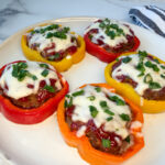 5 individual rings of bell pepper meatloaf on a plate