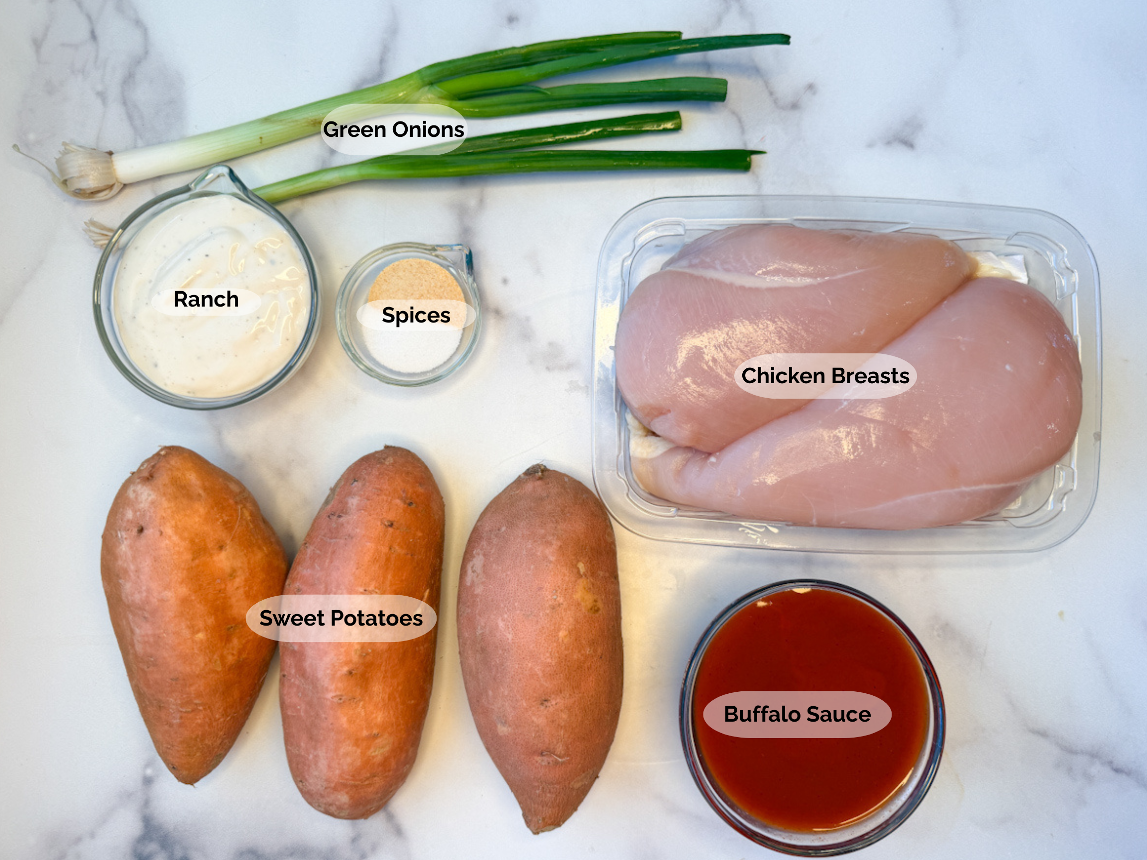 Buffalo Chicken Stuffed Sweet Potato ingredients: 2 boneless skinless chicken breasts, 3 sweet potatoes, buffalo sauce, ranch, spices, and green onions.