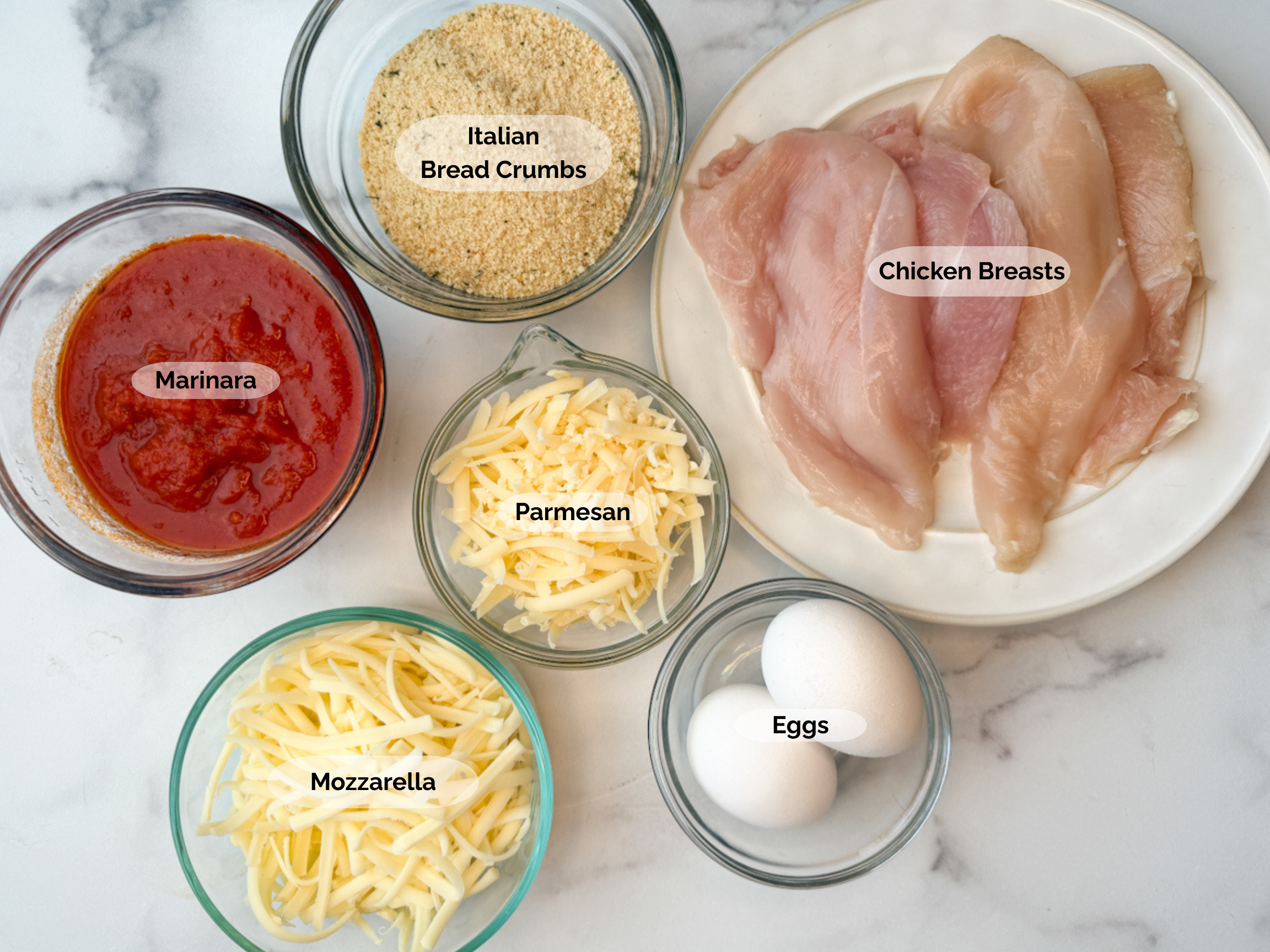 Air Fryer Chicken Parmesan Ingredients: marinara, Italian bread crumbs, 4 thin chicken breasts, 2 eggs, shredded parmesan and shredded mozzarella.