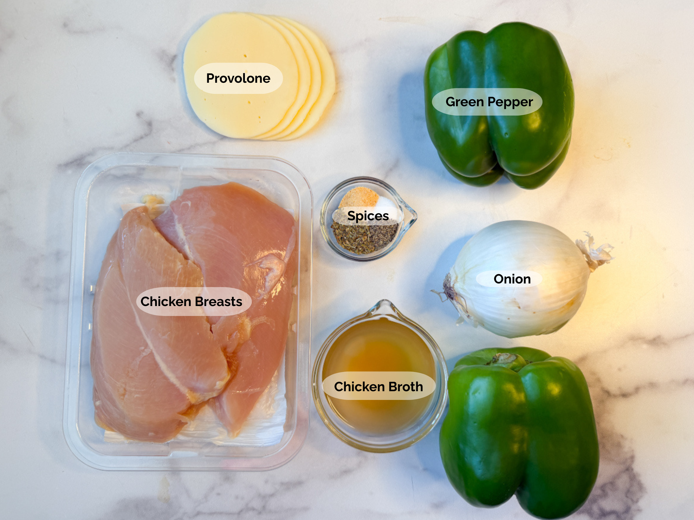 Chicken Philly ingredients: chicken breasts, provolone, green peppers, onion, spices, and chicken broth.