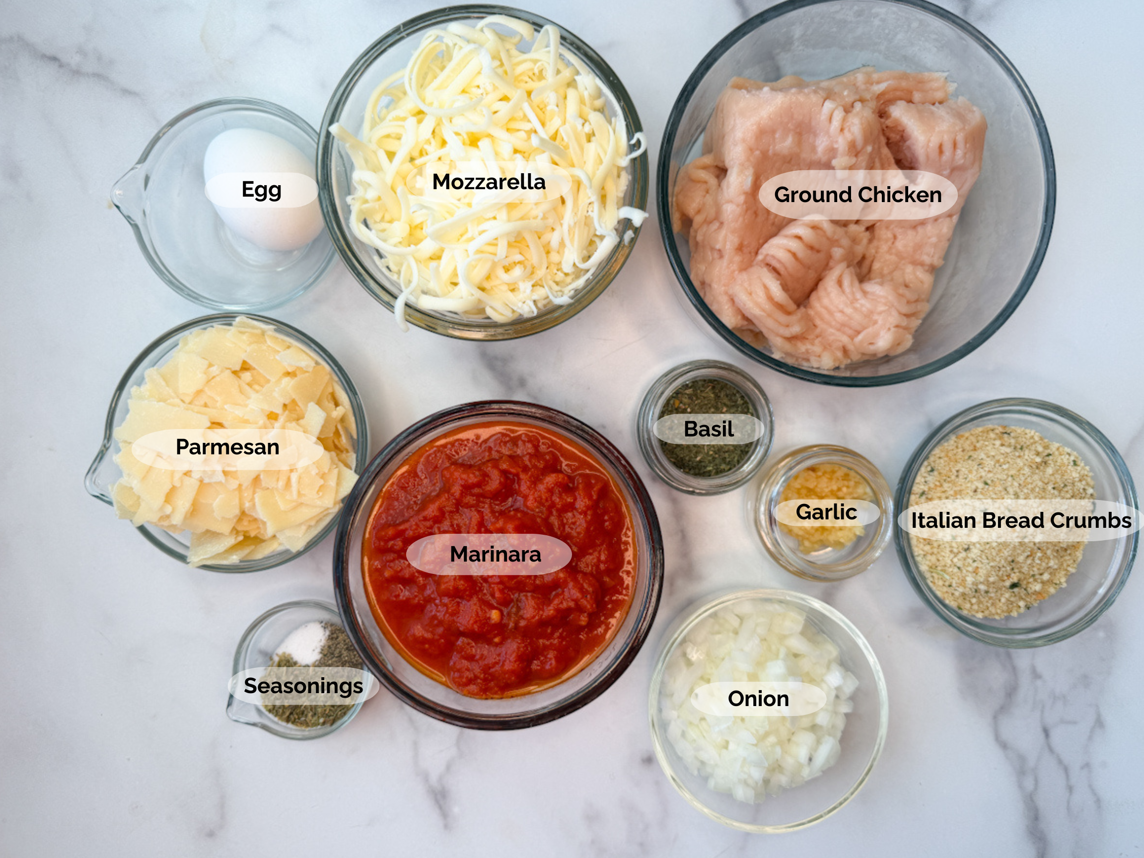 Chicken Parmesan Meatballs Ingredients: ground chicken, shredded mozzarella, shredded parmesan, Italian bread crumbs, garlic, basil, seasonings, chopped onion, marinara, egg,