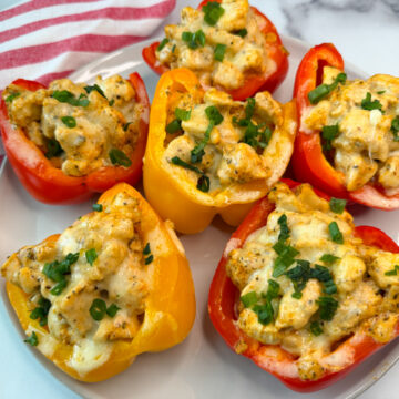6 Chicken Philly Stuffed Peppers stuffed with chicken and topped with melted cheese.