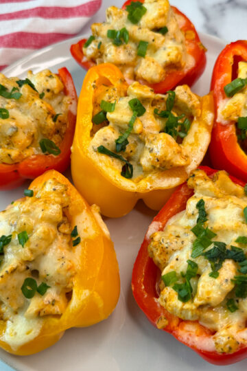 6 Chicken Philly Stuffed Peppers stuffed with chicken and topped with melted cheese.