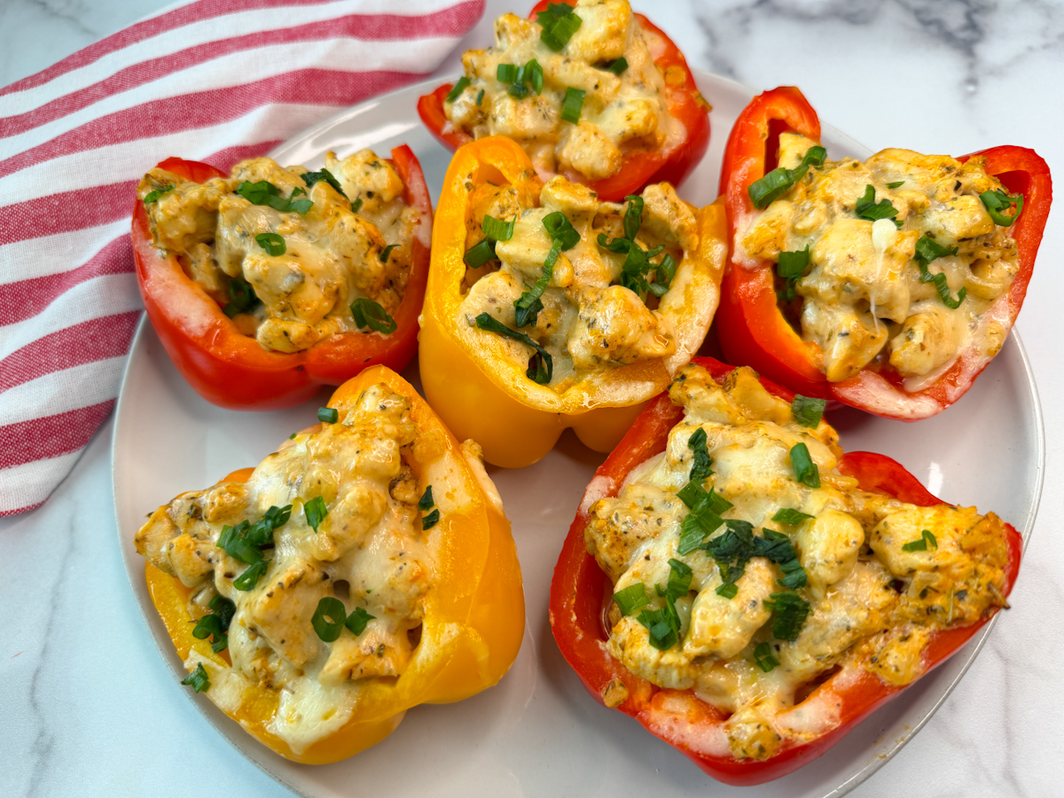 6 bell pepper halves stuffed with cooked chicken and melted cheese making them chicken philly stuffed peppers.