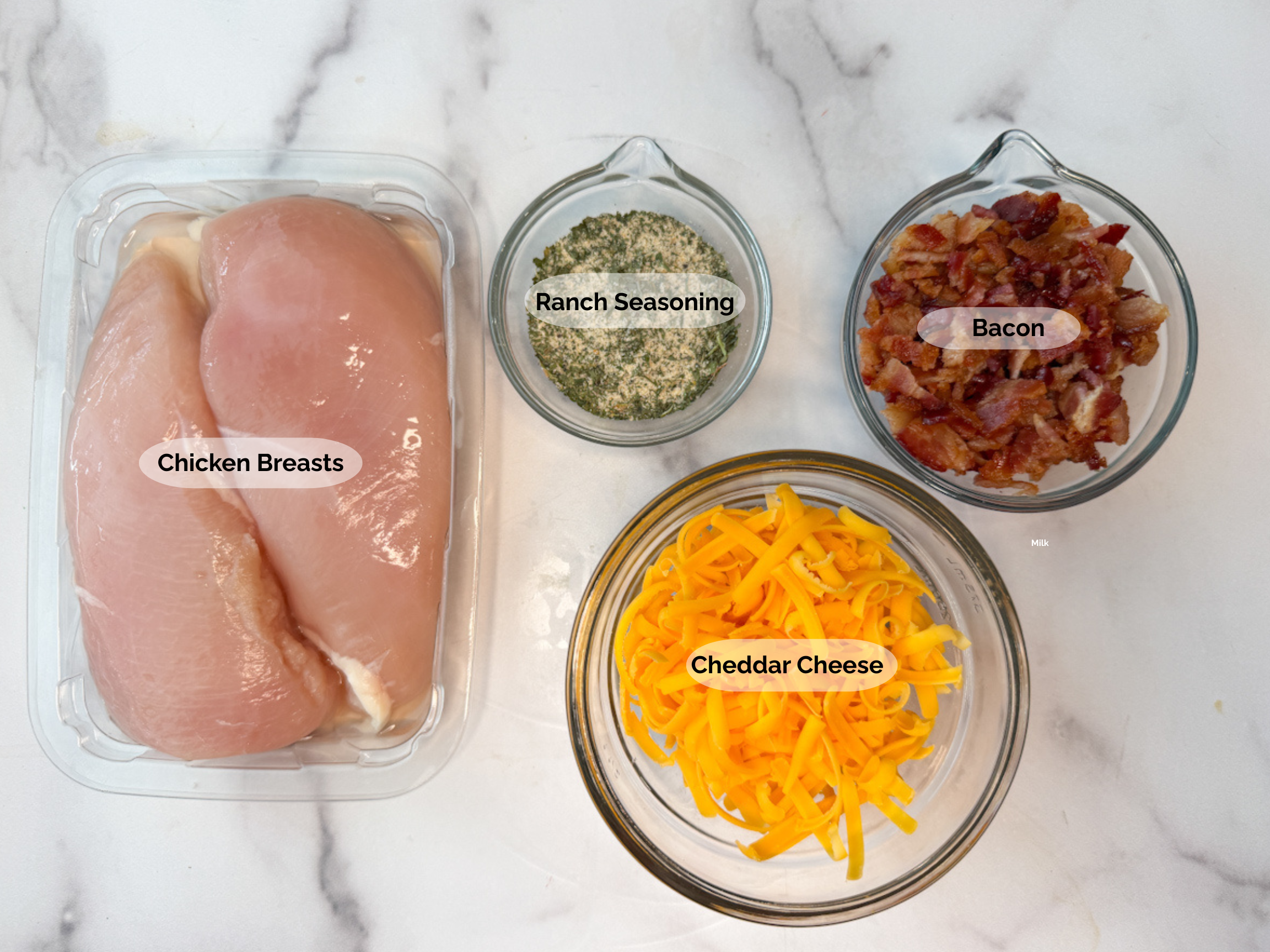 Grilled bacon ranch chicken ingredients: chicken breasts, ranch seasoning, bacon, cheddar cheese