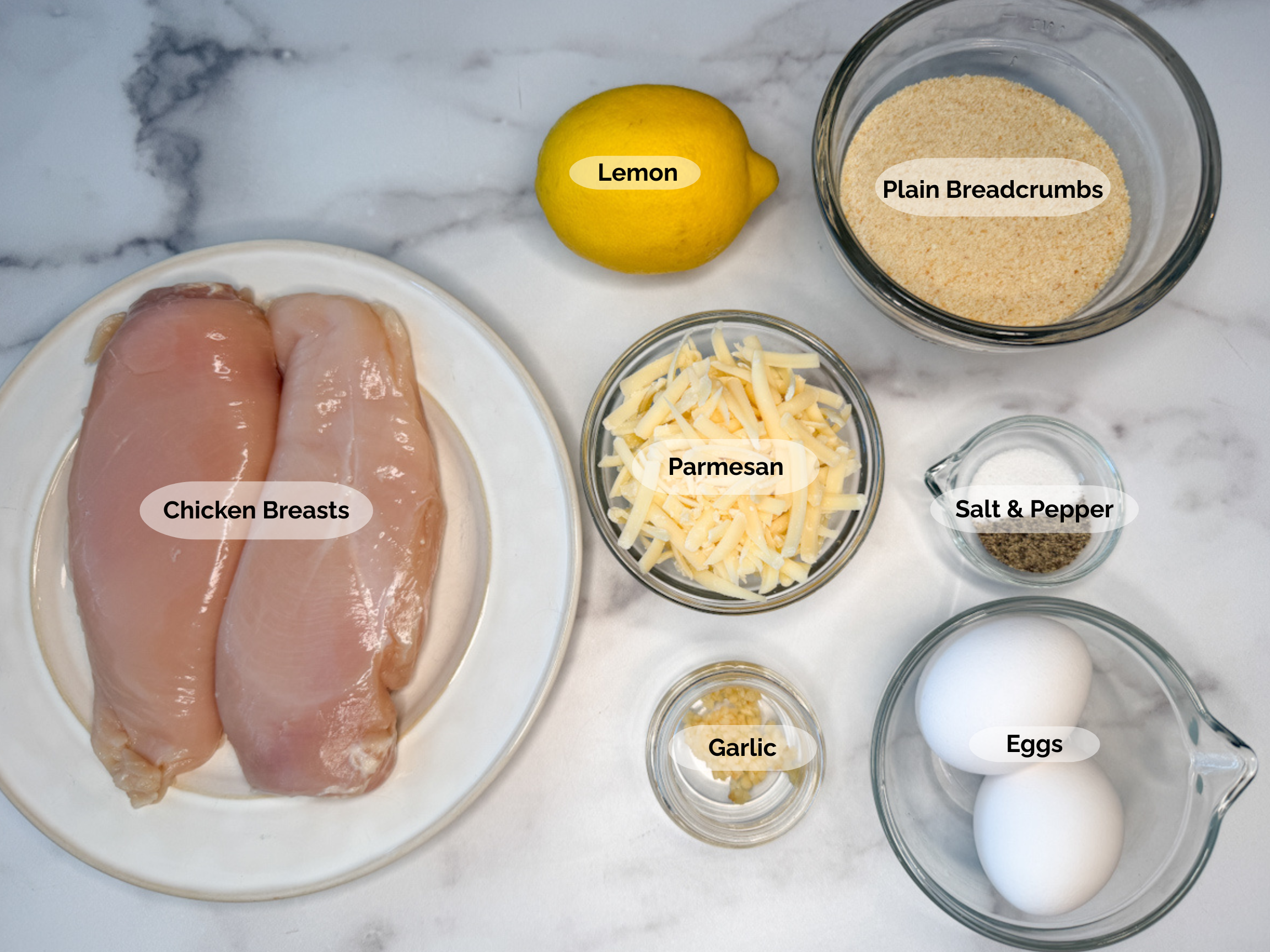 Air Fryer Crispy Lemon Parmesan Chicken ingredients: chicken breasts, lemon, plain breadcrumbs, shredded parmesan, salt and pepper, garlic, and 2 eggs.