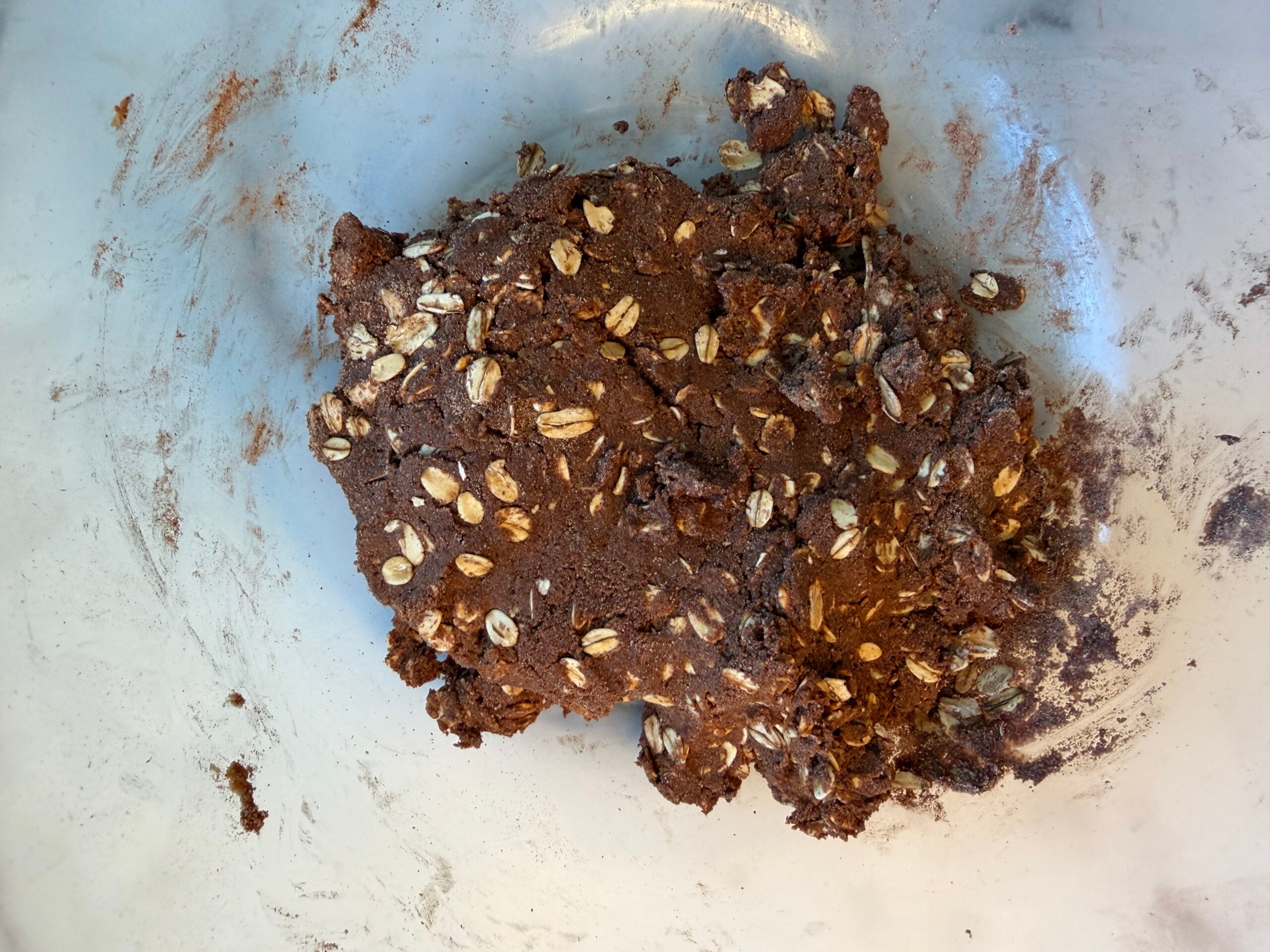 Oats, cocoa powder, chocolate protein powder, salt, honey, almond butter all mixed together.